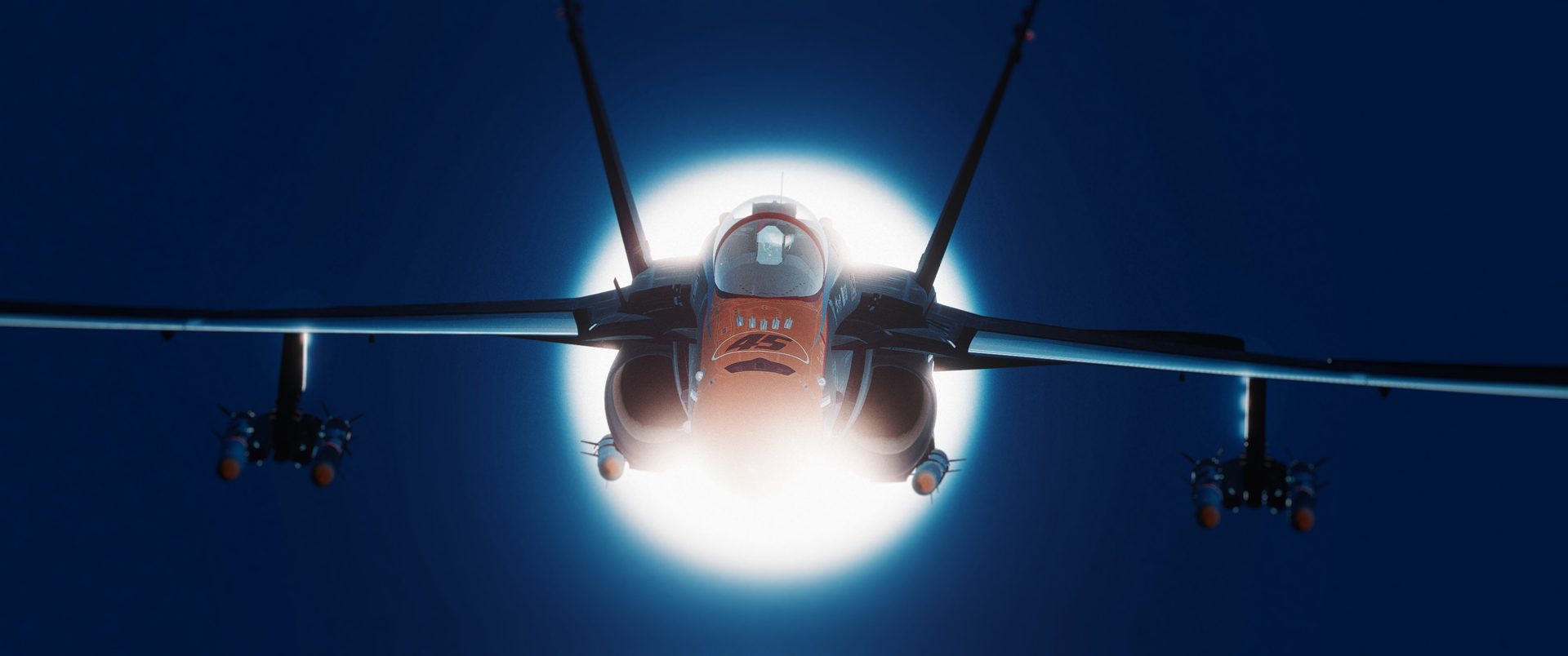An F/A-18C Hornet head-on, framed by the sun