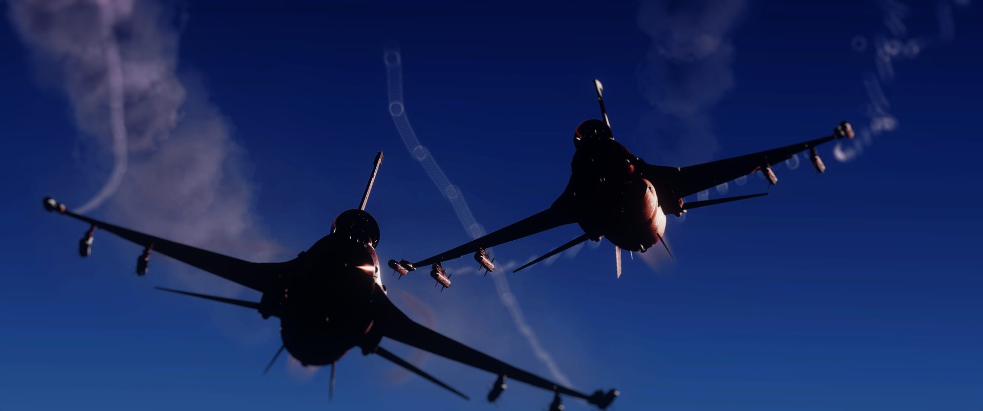 Two F-16C Vipers seen from below against a deep blue sky